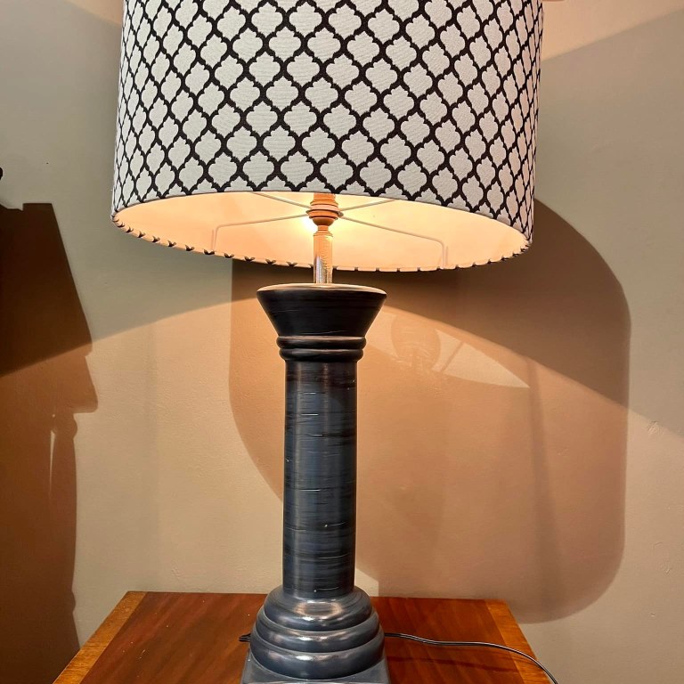 Large lamp with dark pillar shaped base and black and white shade: R1,200