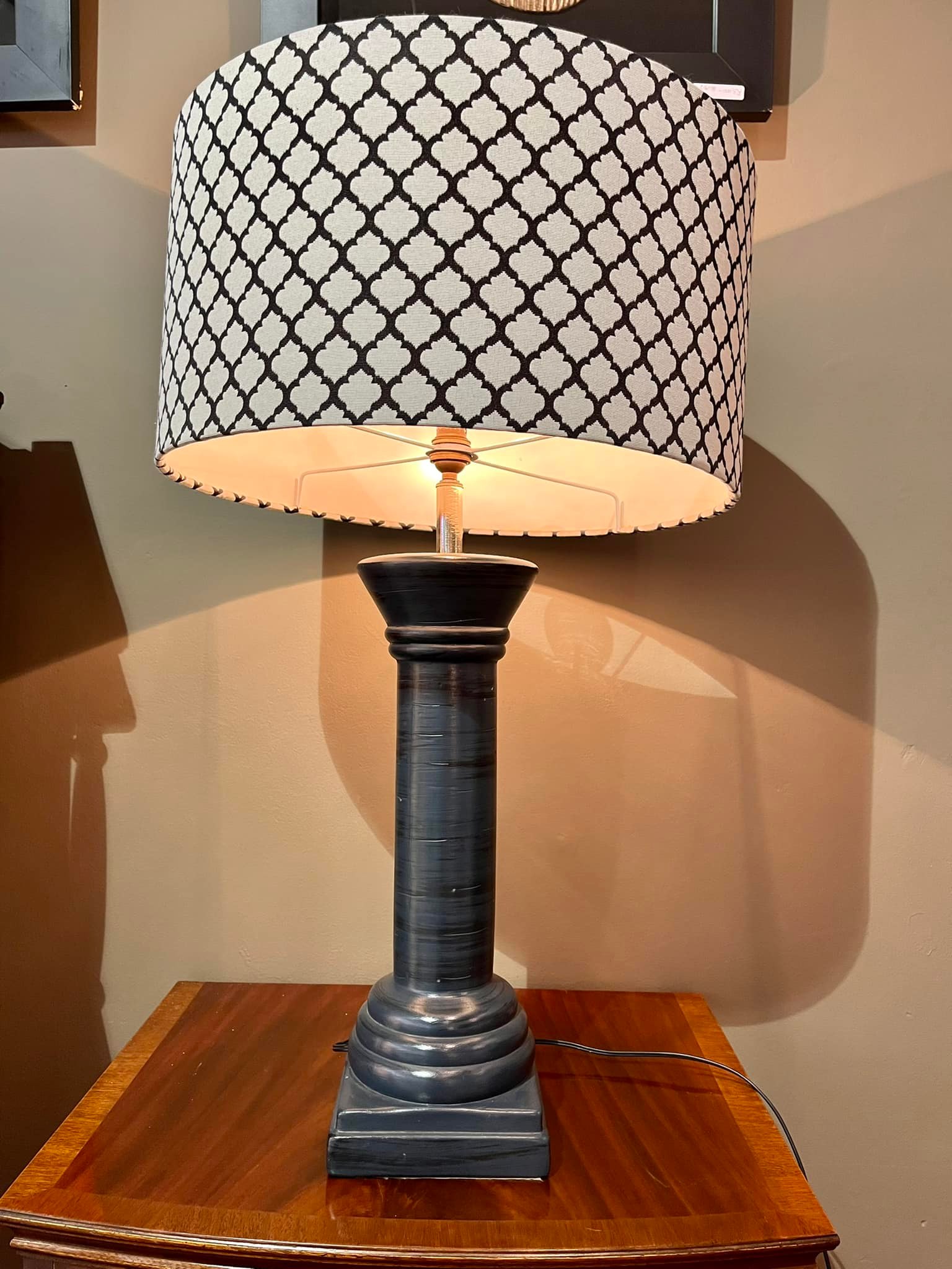 Large lamp with dark pillar shaped base and black and white shade: R1,200