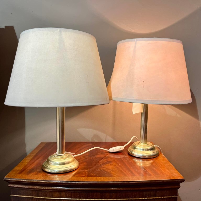 Pair of lamps with brass pillar bases and white shades: R1,600