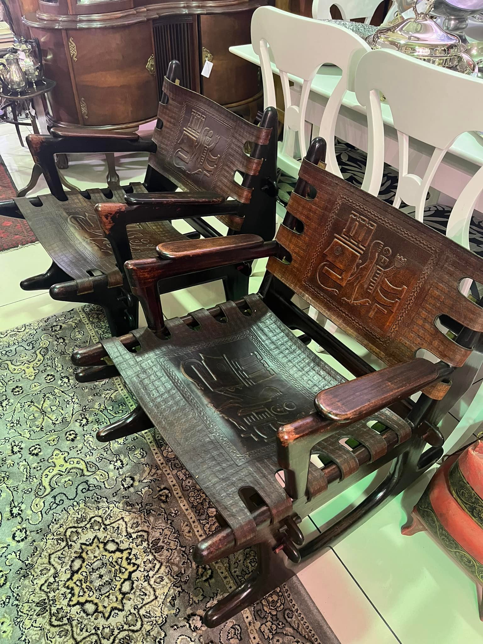 Pair of Angel Pazmino Teak wood and leather rocking armchairs, circa 1960d, Ecuador: R10,000 each