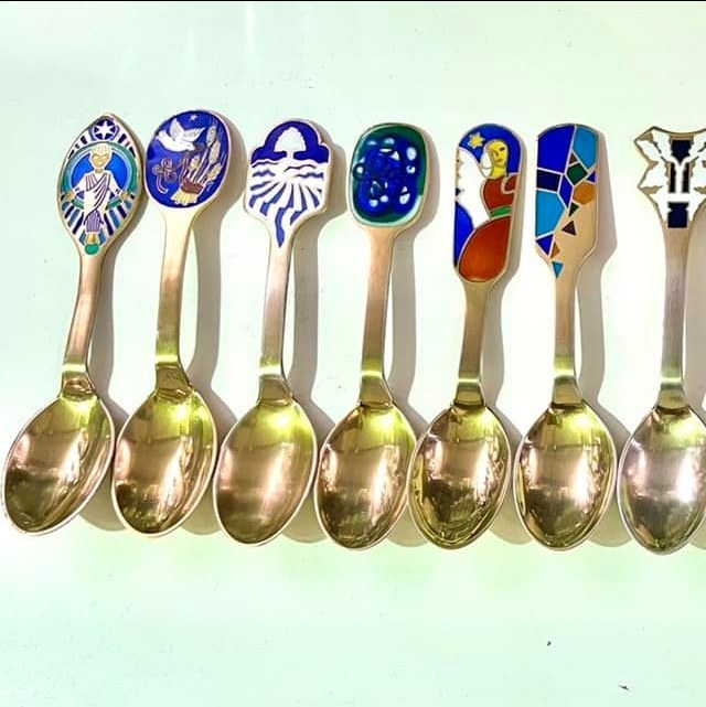 Anton Michelsen Danish Christmas Spoon collection 15 spoons collected from 1984 to 2006. The designer dessert spoons are gold plated sterling silver (800 grams in total) with enamel designs: POR