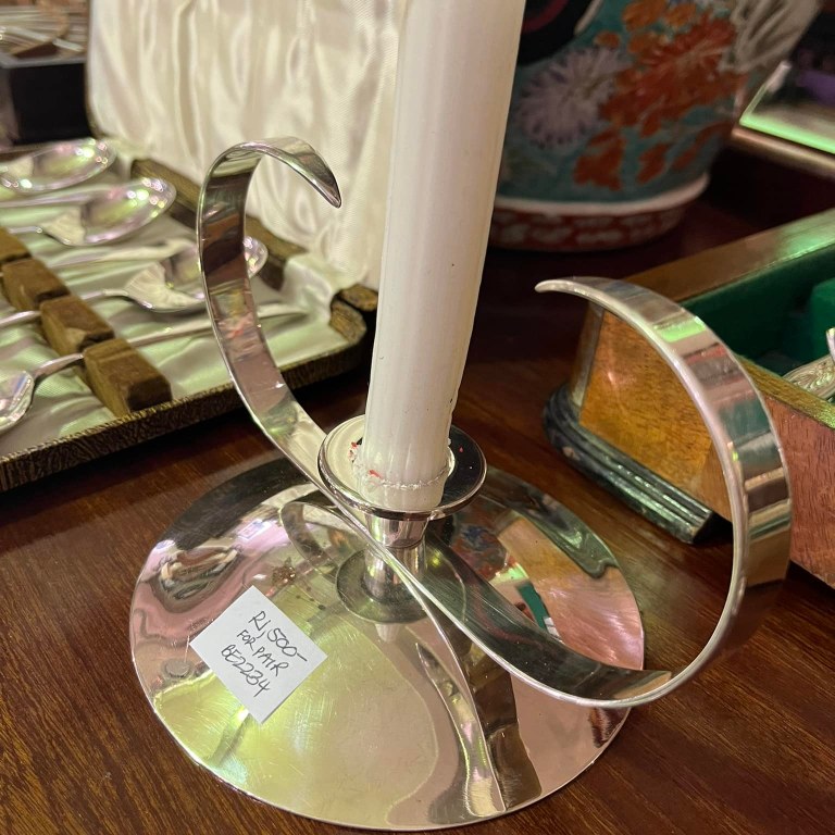 Pair of aluminum candle holders: R1,500