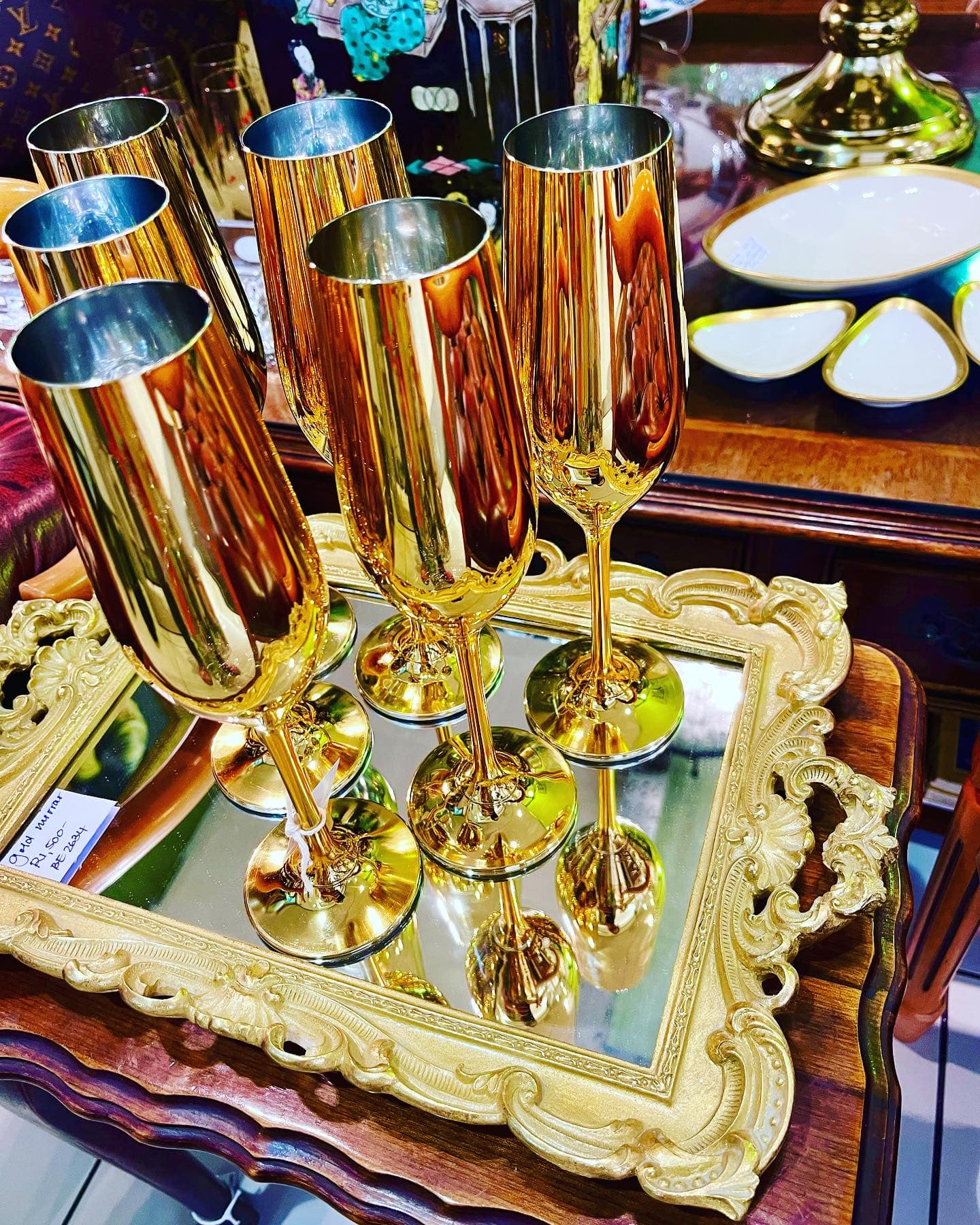 SOLD! Set of 6 gold plated champagne flutes: R6,000 and gilded mirrored tray: R1,500