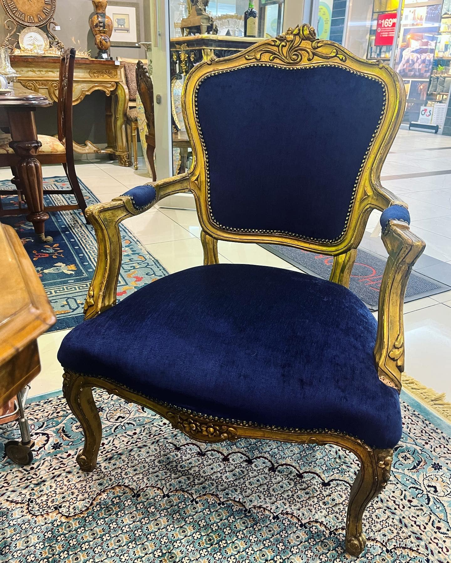 Pair of antique French XV giltwood armchairs with blue velvet upholstery