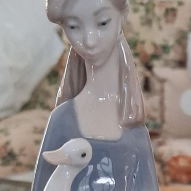 Nao by Lladro girl holding a duck or goose: R2,500 Nao by Lladro girl holding a duck or goose: R2,500