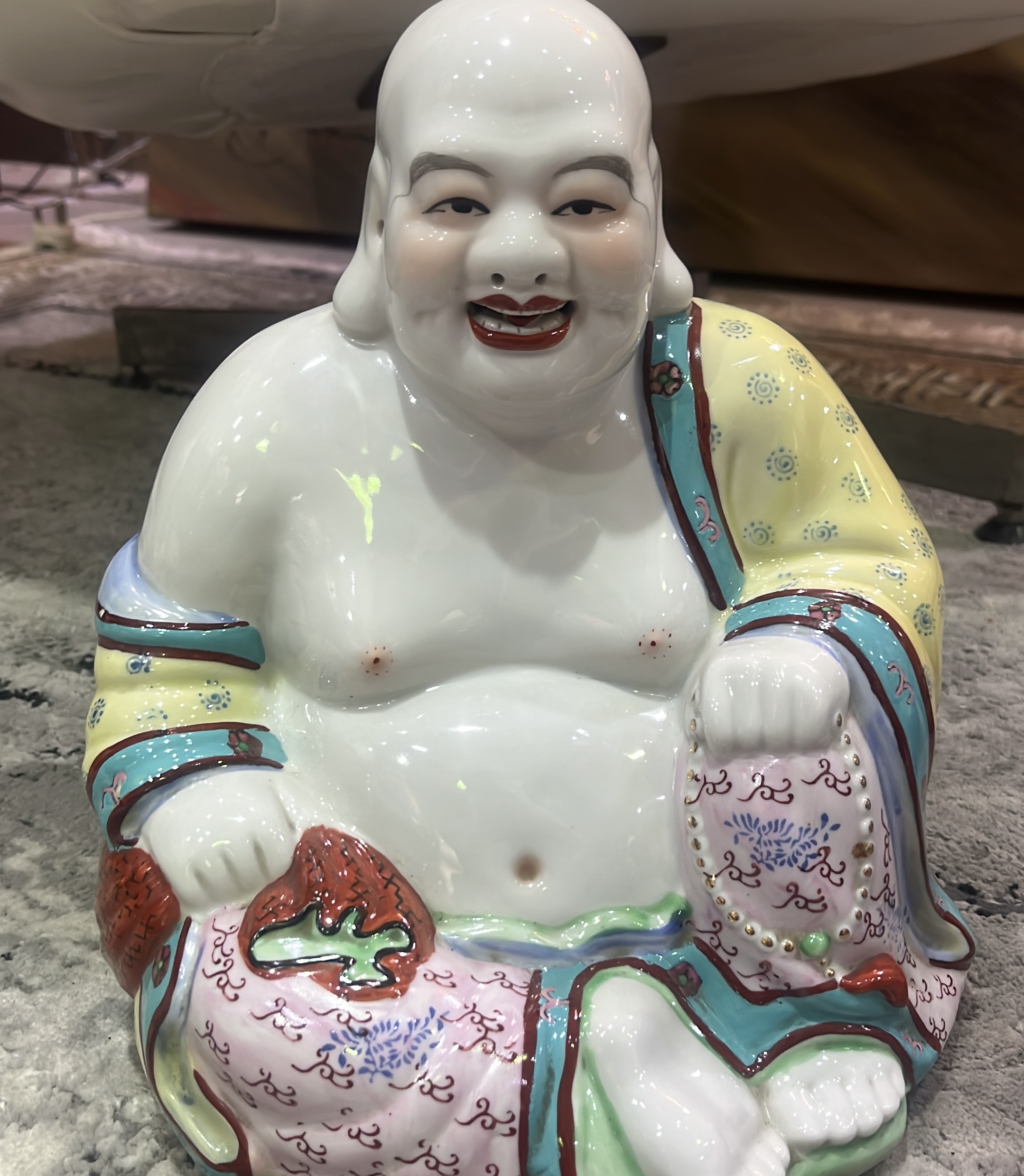 Porcelain laughing buddha