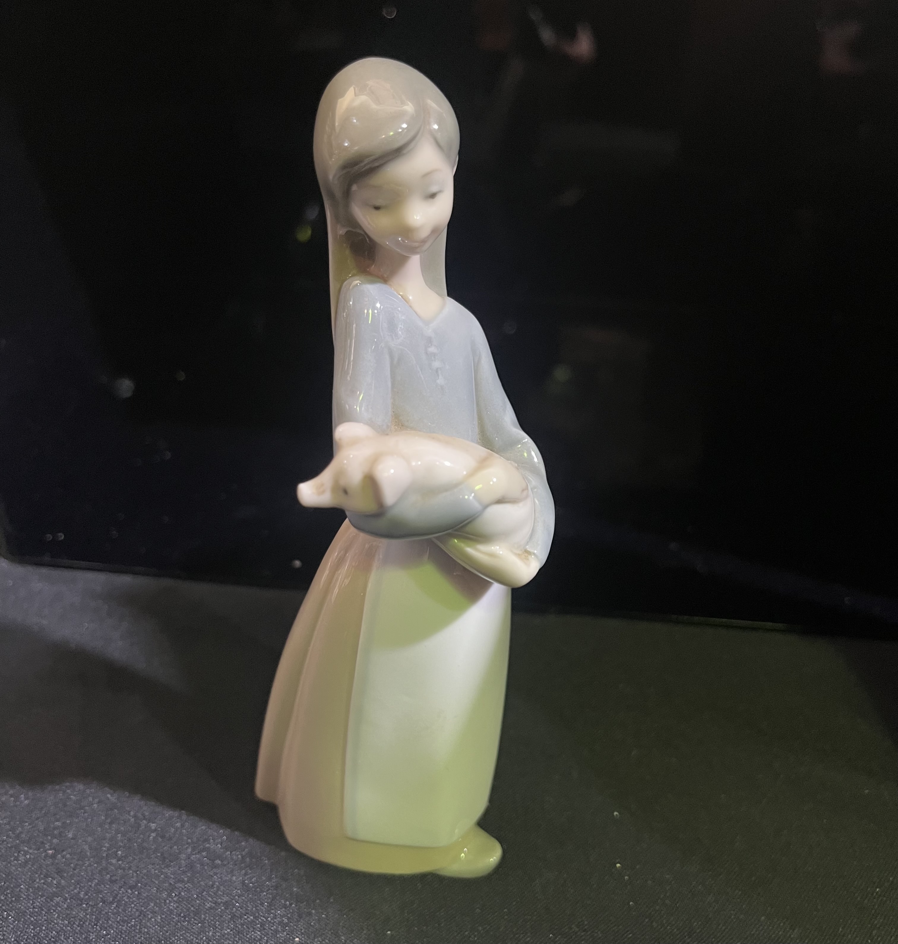 Lladro Girl with a pig figurine
