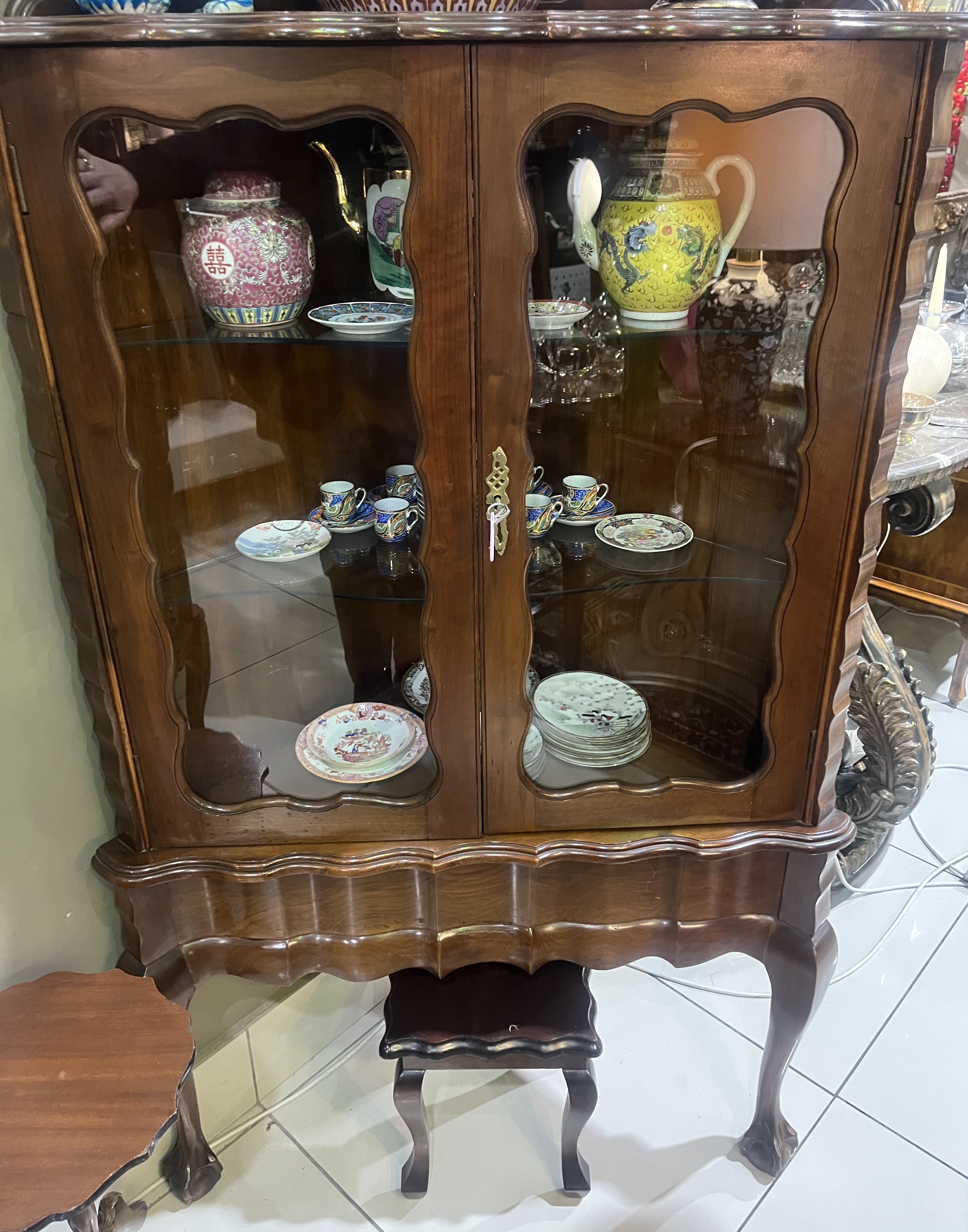 Stinkwood corner ball & claw display cabinet: R20,000