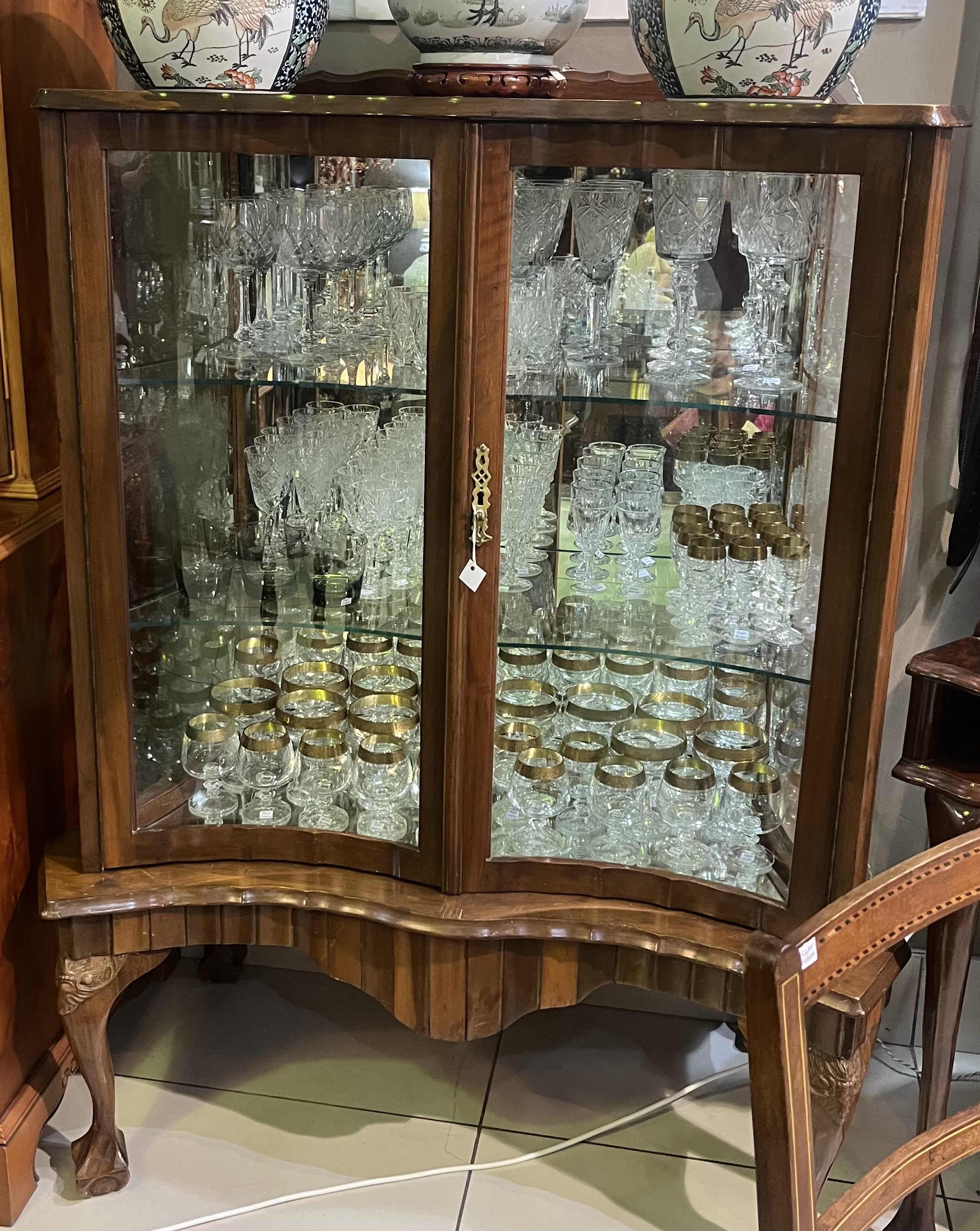 Stinkwood ball & claw display cabinet: R25,000