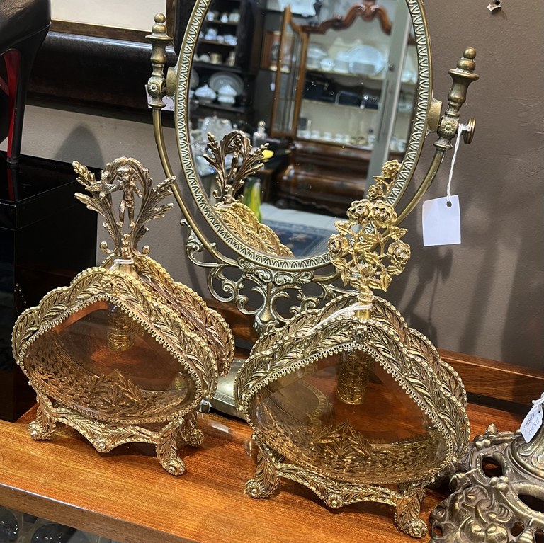 Pair of Hollywood Regency gold tone filigree and amber bevelled glass scent bottles, circa 1960s, heights 25 cm