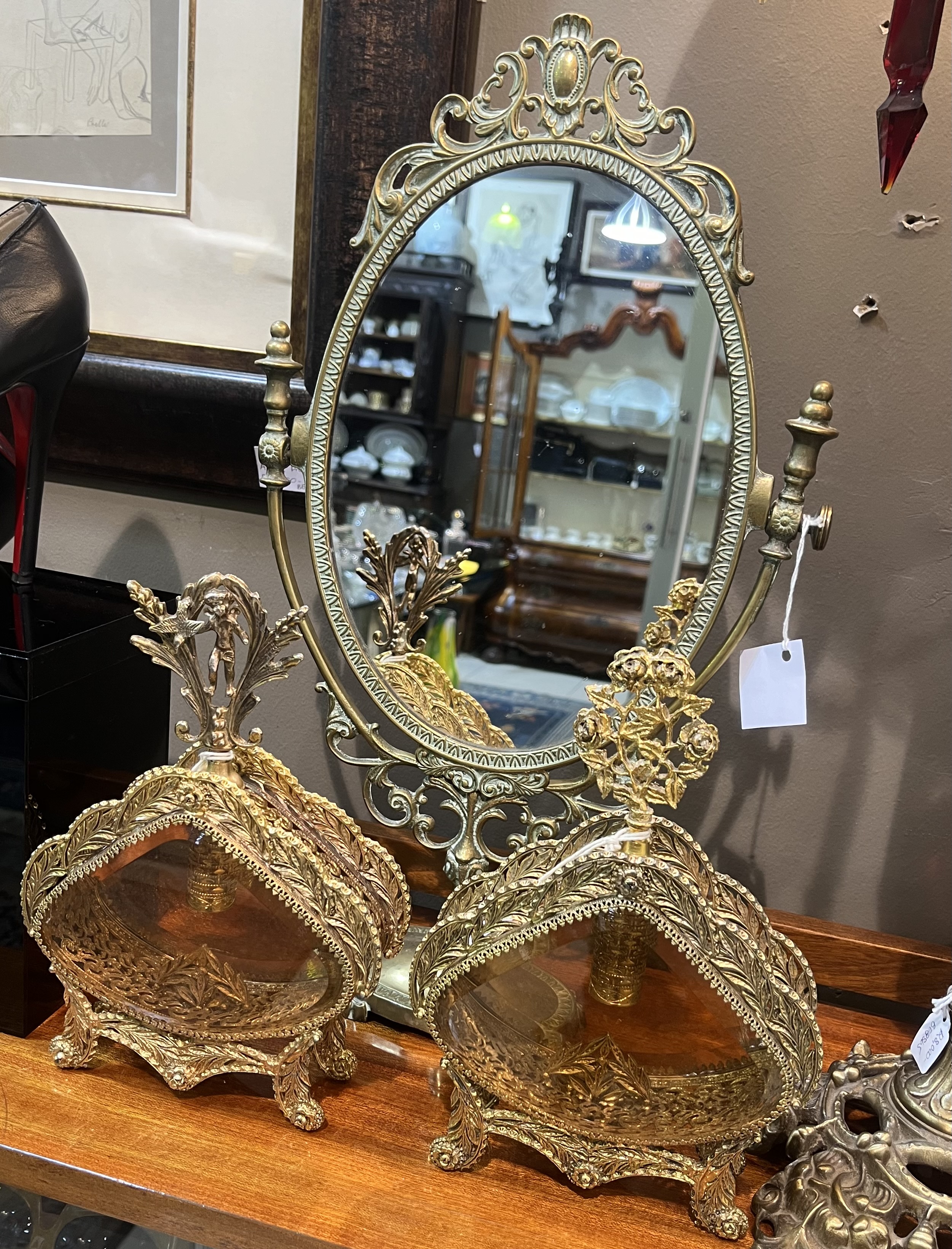 Pair of Hollywood Regency gold tone filigree and amber bevelled glass scent bottles, circa 1960s, heights 25 cm