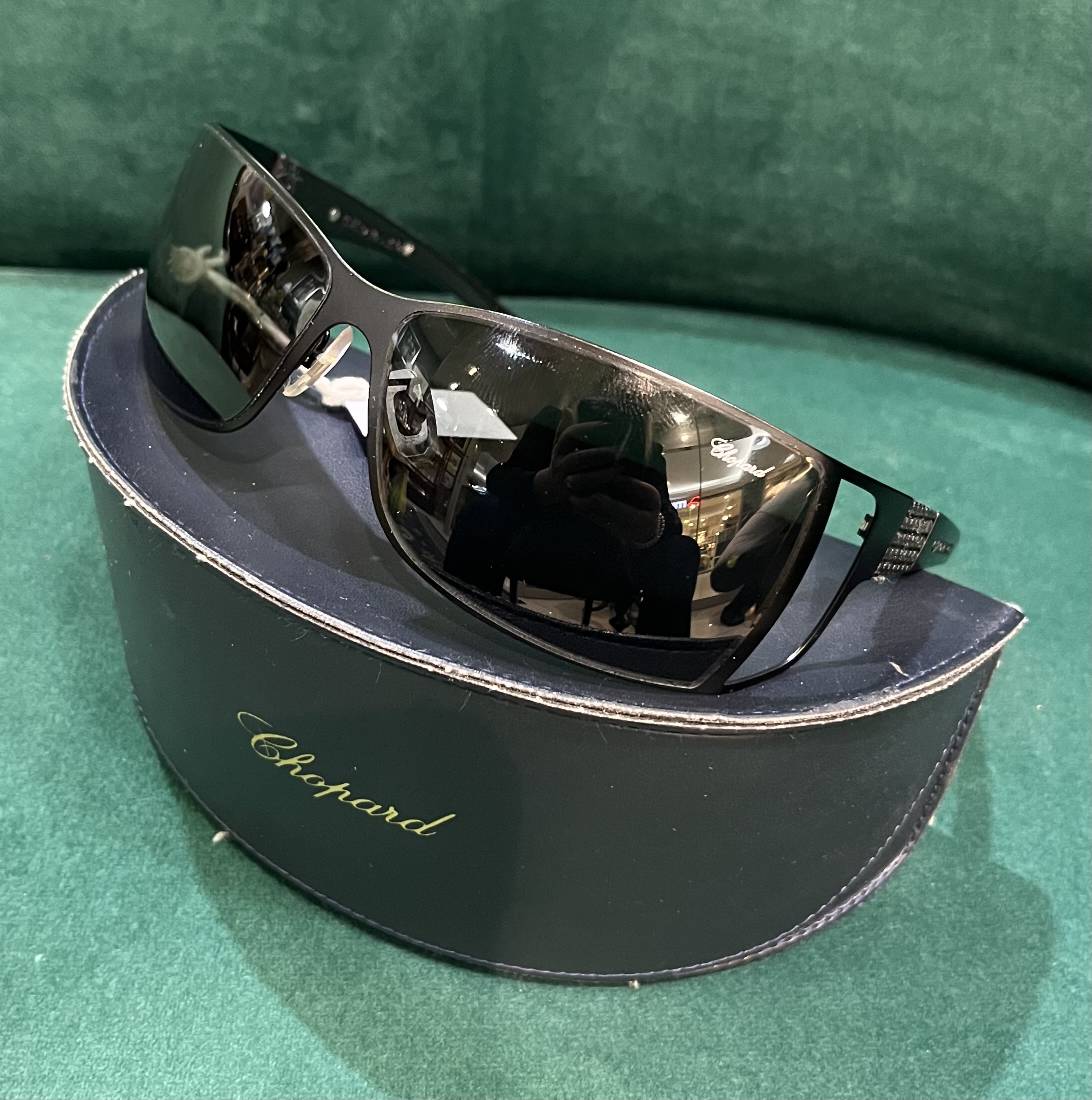 Pair of Chopard wrap-around sunglasses with black tone metal frames, textured black acetate arms