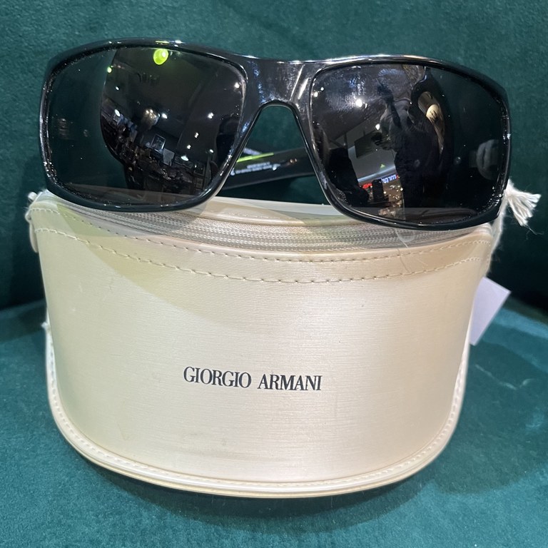 Pair of Giorgio Armani sunglasses with black acetate frames, silver tone logo to temples