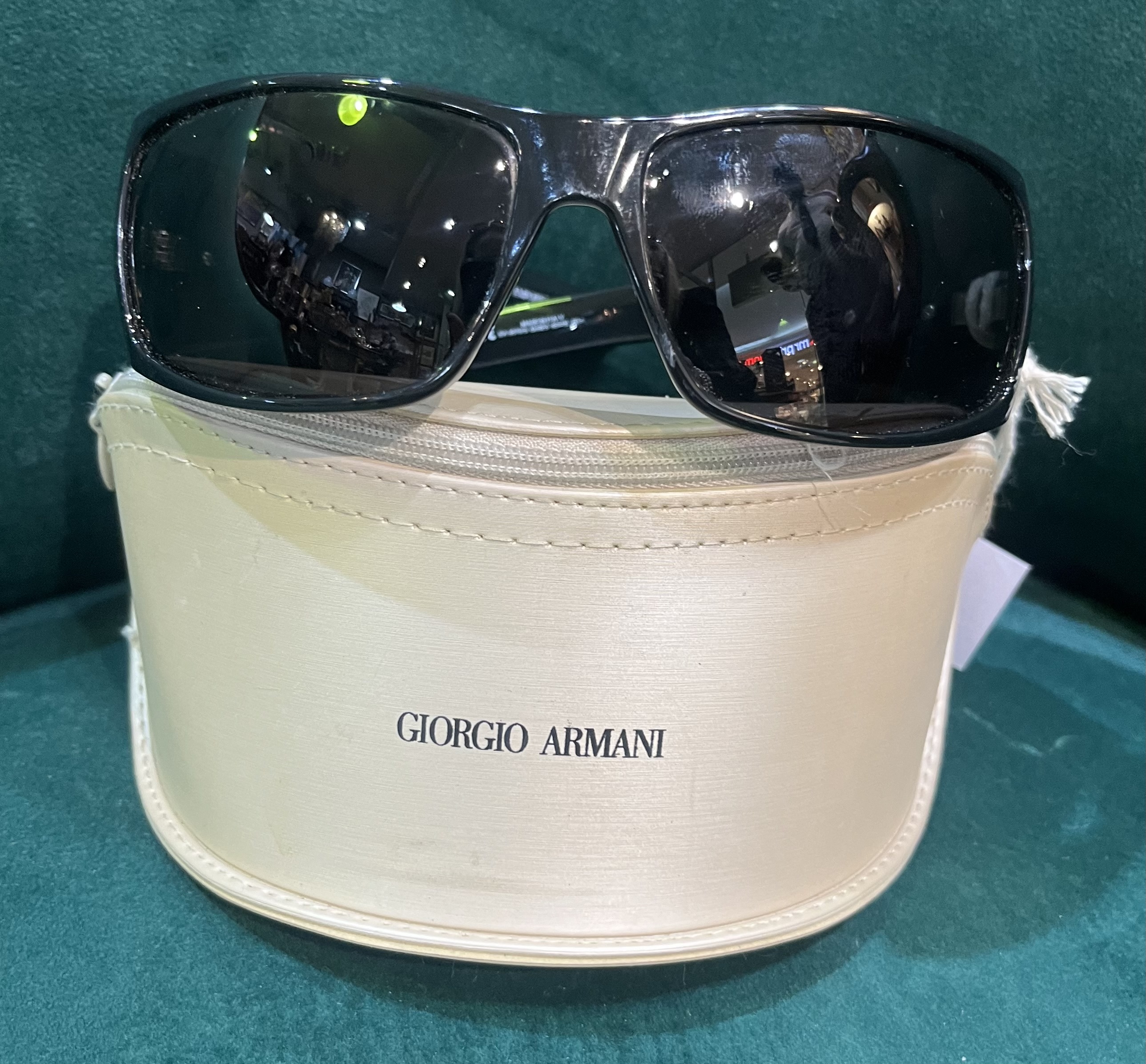 Pair of Giorgio Armani sunglasses with black acetate frames, silver tone logo to temples