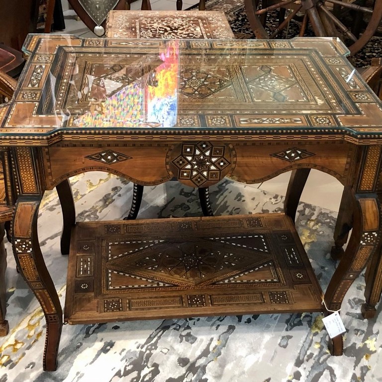 Early 20th Century Syrian games table and chairs with multiple geometric and asymmetric marquetry in various woods and mother-of-pearl. Table Size: 0.78m (height) x 0.94m (width) x 0.62m (depth)  Price for table and chairs set: R90,000.00