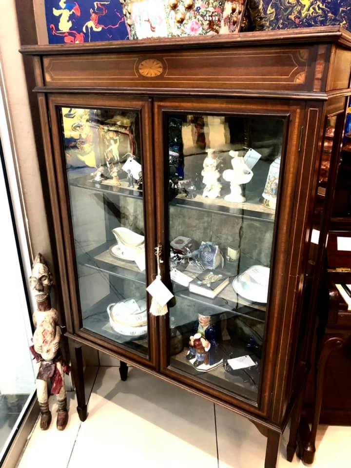 Edwardian bookshelf with handmade glass panels and olive green velvet covered shelves, early 20th Century, in perfect condition and with original key. Size: 1.53m (height) x 0.93m (width) x 0.39m (depth) Price: R12,000.00