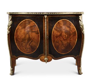 A George III gilt-lacquered brass mounted mahogany, stained sycamore, tulipwood-banded and inlaid commode, circa 1765-70, attributed to John Cobb