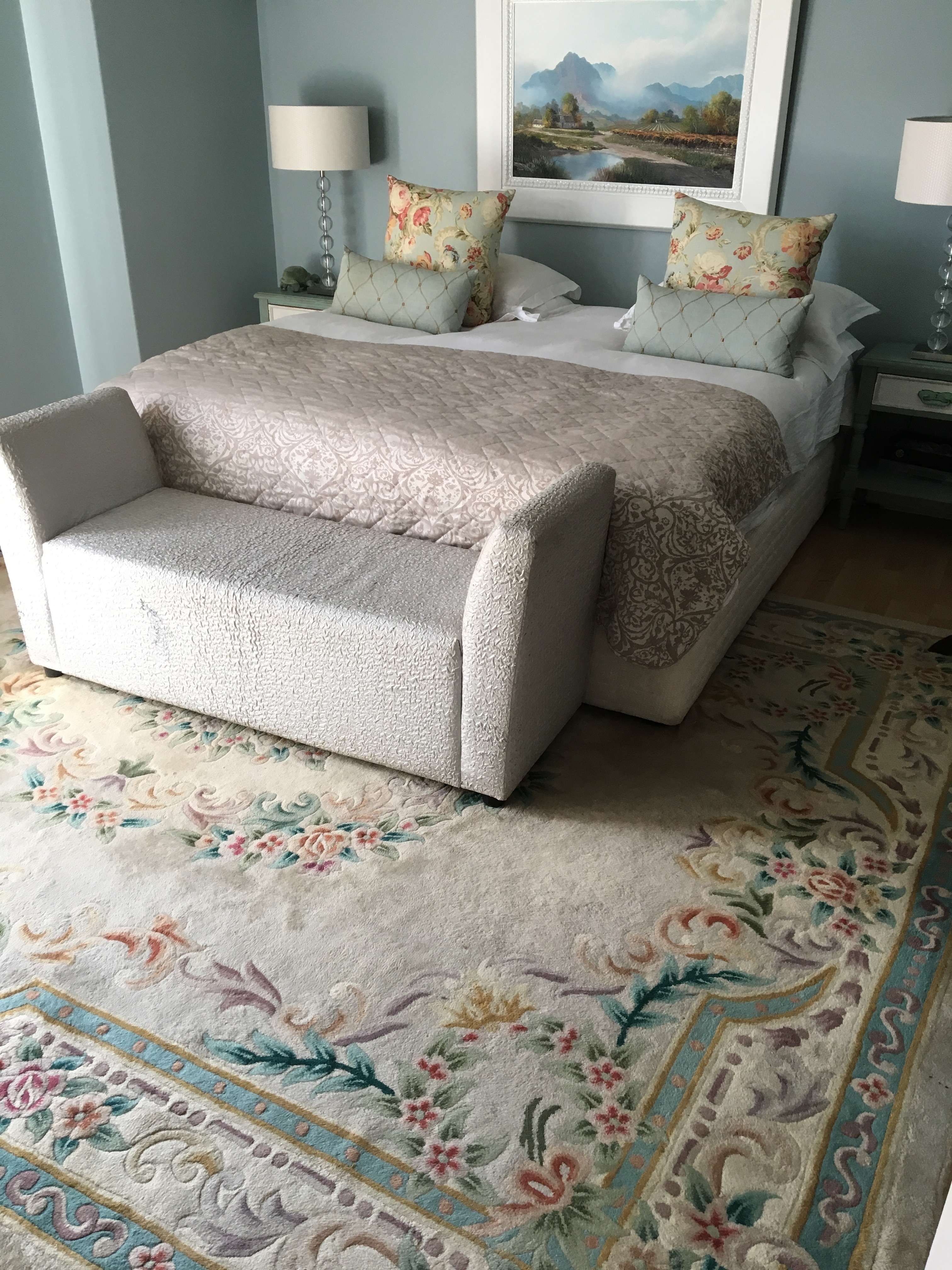 The oversized carpet half way under the bed - this option plays the role of bedside carpets and coverage at the foot of the bed