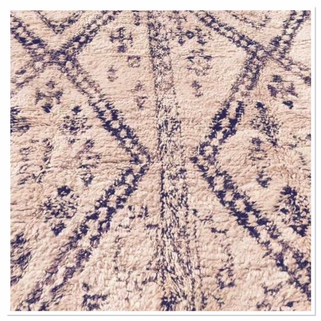 Close up of Beni Ourain rug with diamond design and motifs