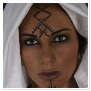 Female member of the Amazigh Berbers in Morocco with her facial tattoos
