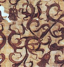 Detail of an embroidered silk gauze ritual garment. Rows of even, round chain stitches are used both for outline and to fill in color. The presence of wingless dragons are all over. From a 4th century BC, Zhou era tomb at Mashan, Hubei province, China.